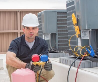 An HVAC contractor working on a new air conditioner installation.