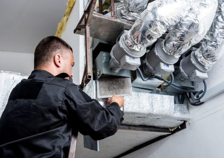 The expert checks the accumulator in the HVAC system.